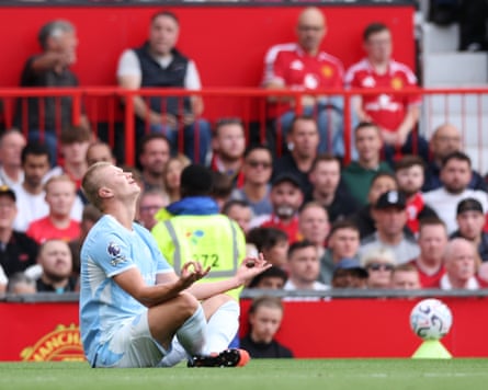The Manchester City striker Erling Haaland celebrates scoring away to Manchester United at Old Trafford by performing a yoga pose.