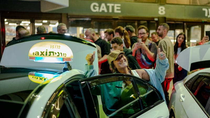 A relieved passenger from Flight FZ1073 after landing in Israel. Getty Images