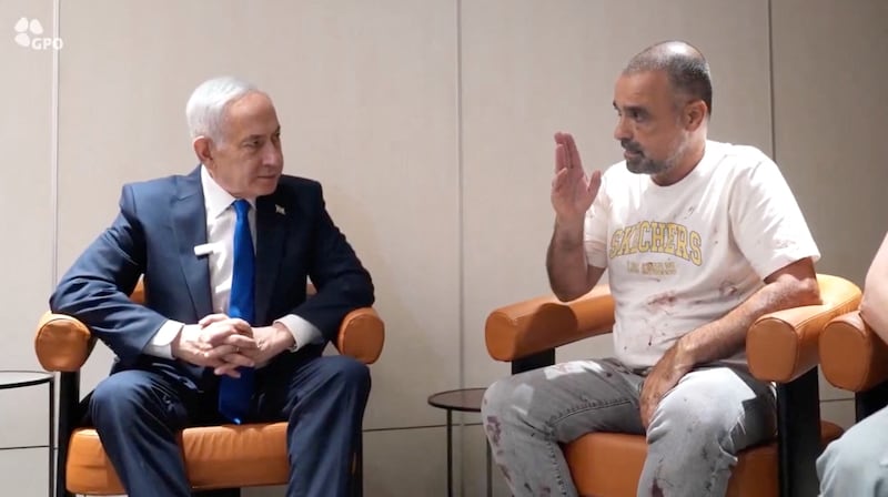 Israeli Prime Minister Benjamin Netanyahu meets Yaniv Hayun, a passenger on the Flydubai flight bound for Israel from the UAE. Reuters