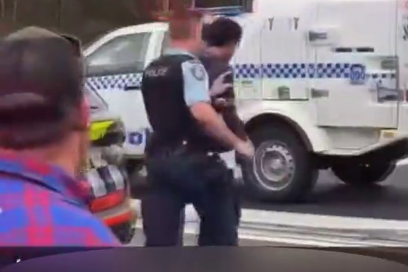 Driver being arrested.