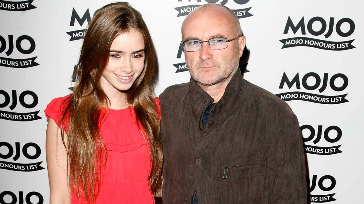 Phil Collins and Lily Collins at the MOJO Honours List 2008 in London in June 2008