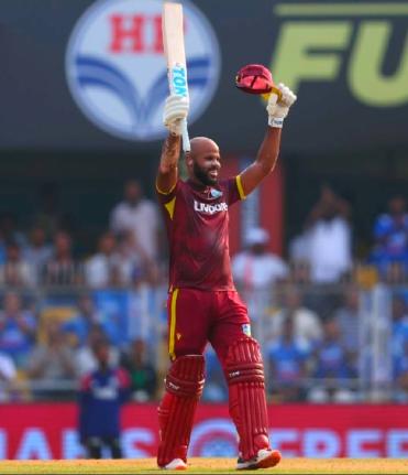 West Indies opener John Campbell celebrates a century against India that will later prove in vain yesterday.